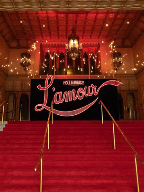 L'Amour sign on steps of Regent Theatre