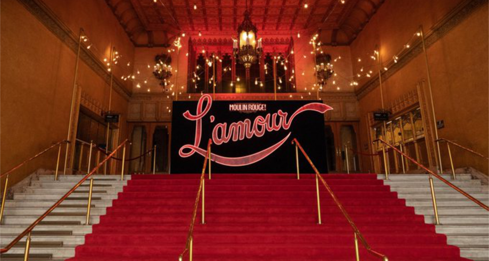 L'Amour sign on steps of Regent Theatre